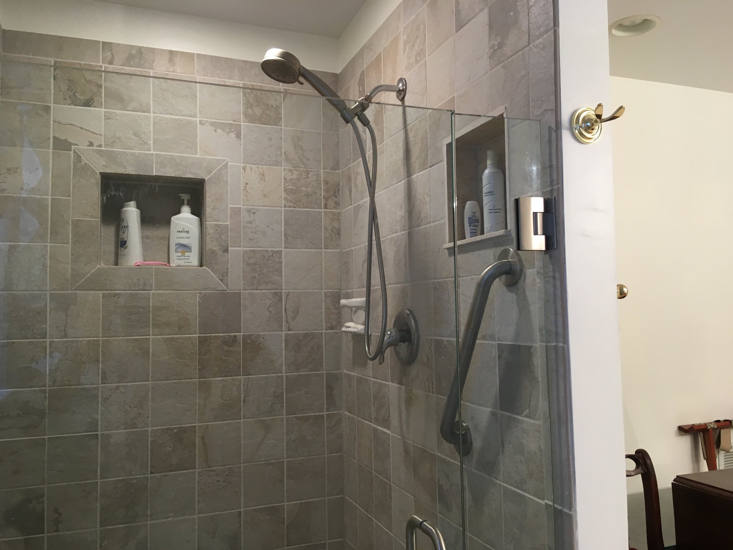  New tiled bathroom complete with Rain-X coating for glass doors, two niches, all new shower plumbing fixtures and tiles. 