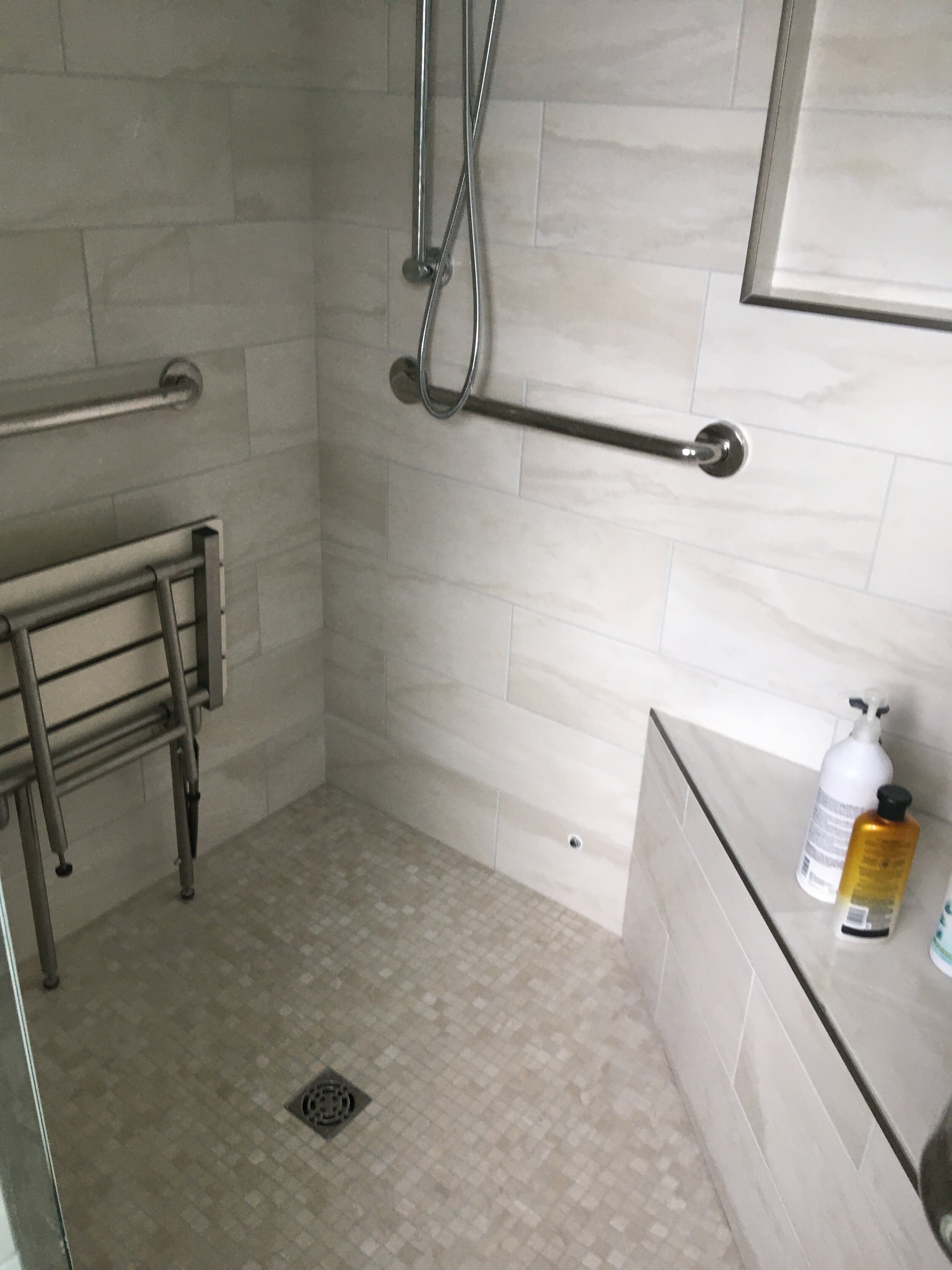  This tile bathroom was completely remodeled due to the original tiled leaking into the ceiling below. The entire shower was removed and the Schluter tile system was installed, before all new tile was added and grouted with the Mapie premixed grout. 