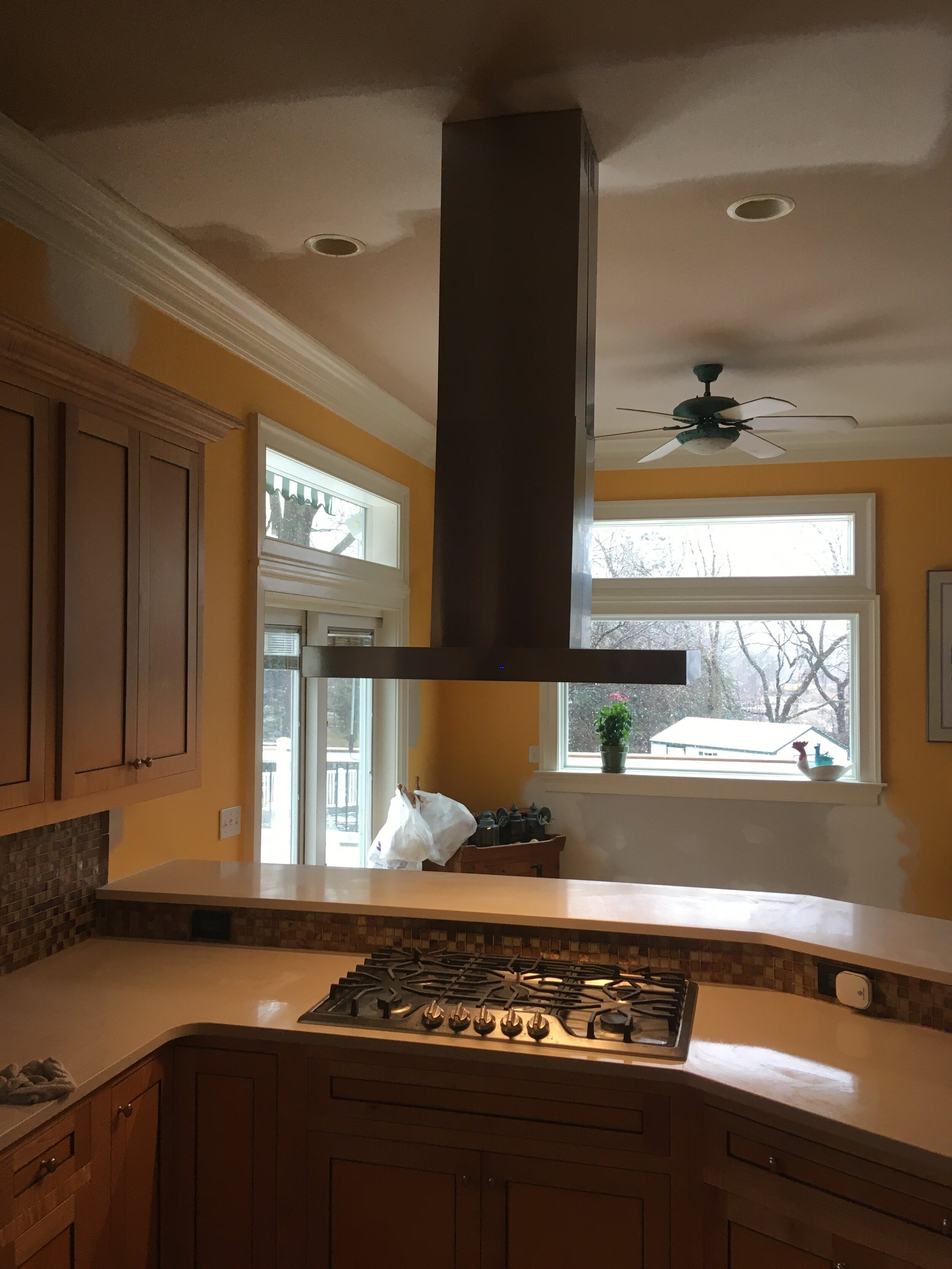  A Zephyr rang hood was installed in a kitchen with a ten foot ceiling. 