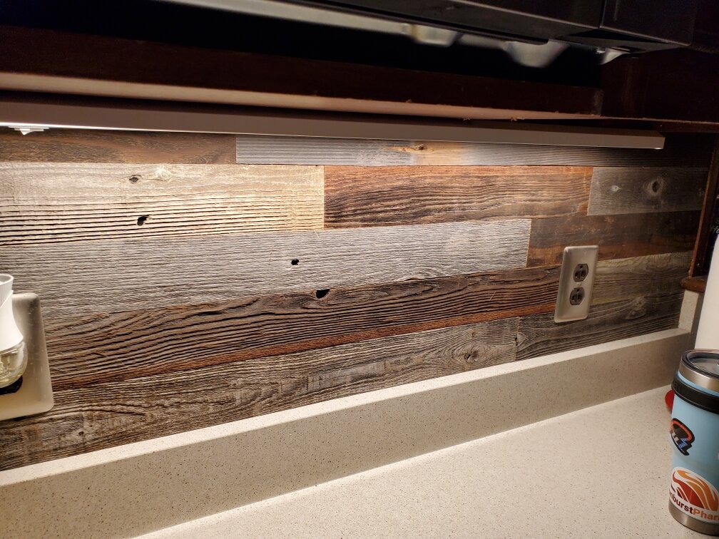  This Plank and milled reclaimed barn board is used as a backsplash. 