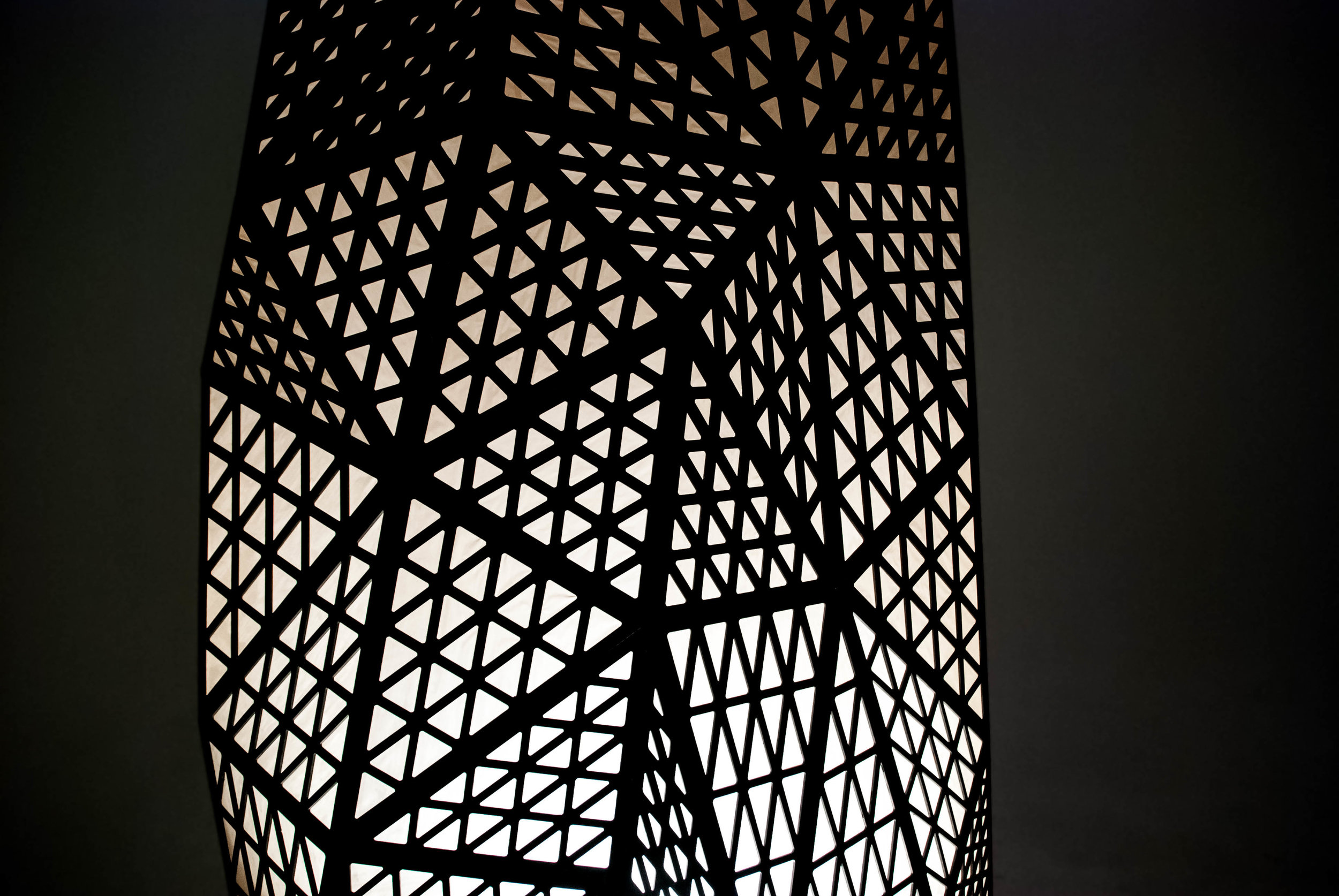 The complex structure was digitally designed using visual-based parametric scripting technology, then each piece was laser cut and the sculpture was assembled in-house.