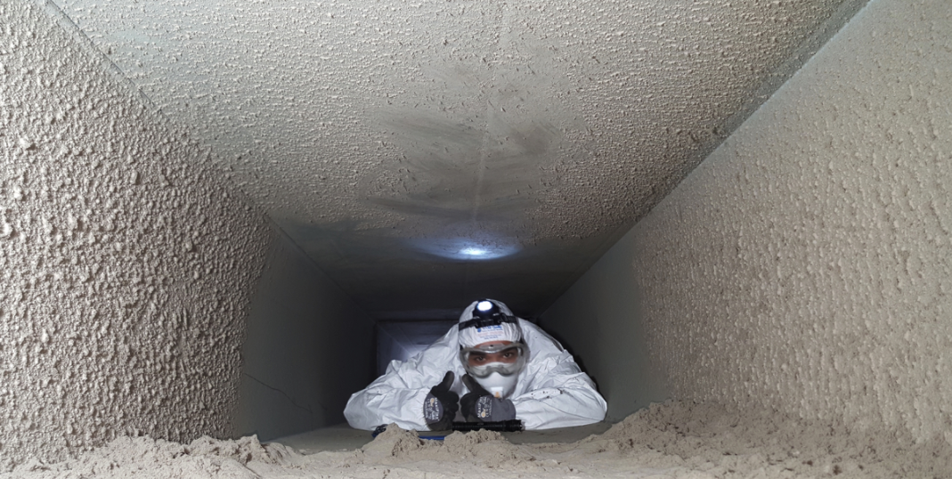 Air Duct Cleaning Technician removing dust and debris in ventilation system