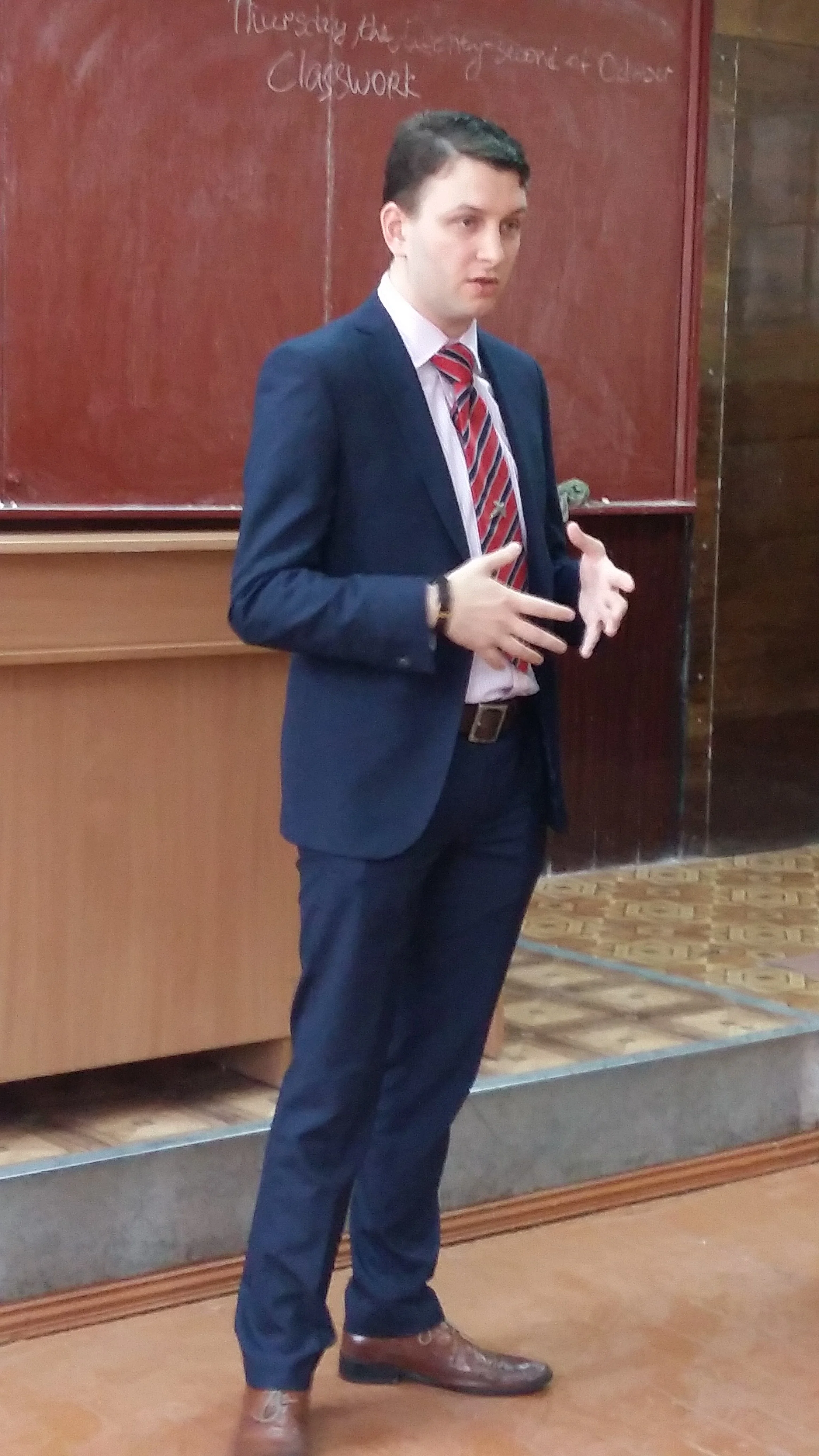 Peter J Cribley addresses a group of students at a Kharkiv region school.