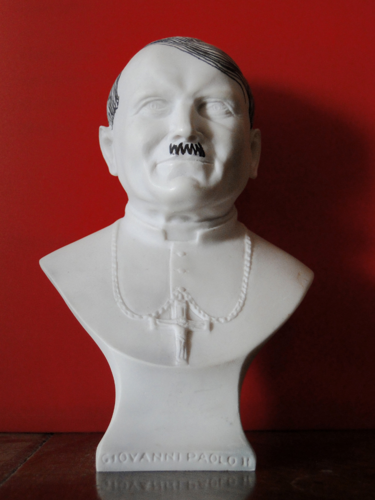 2009 Acrylic pen on resin sculpture Dimensions variable Back from a trip to the Vatican, Sebastian Errazuriz confesses that to avoid boredom on the plane, he brought with him a resin bust of Pope John Paul II, wich he bought as a souvenir. Although the artist has not expressed the meaning behind tampering with the religious figure, we can only assume it is another exercise in which he addresses his public condemnation of the Catholic Church, which has banned the use of condoms in Africa while the continent battles an AIDS epidemic.