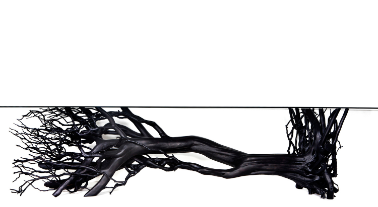 2008 Crespon tree, stainless steel and glass top Base: 29”h x 150”l x 43”w (73.6cm x 381cm x 109cm x 80cm) Glass: 165” x 43 1/4” (420cm x 110cm) The Tree Table questions the historic paradigm of using wooden boards to create a table. It proposes that no matter how beautiful or sophisticated our designs might be, the shapes we find in nature are often more mysterious and intriguing. In a simple act, Sebastian ErraZuriz lays a tree horizontally, laser-cuts its branches to height, and places a glass on top. Humberto Campana of the Campana brothers, a noted Brazilian design duo, would later admit to ErraZuriz during a dinner conversation that this was one of those designs he envied and wished he had conceived.