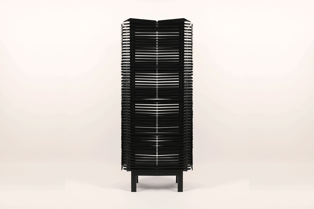 2014 Lacquered maple, stainless steel and glass W:31-3/4 x H:71 x D:17-1/2 in (W: 80,5 x H: 180 x D: 44,5cm) The Samurai Cabinet continues Sebastian ErraZuriz's series of innovative works on furniture as a medium. Almost 400 individually movable keels construct a flexible skin which allows its contents to be accessed from any angle.The small spear shaped pieces allow its shape to shift and change depending on the positions in which they are arranged. Cleverly counterbalanced on a pivoting point, each spear instantly flips open by simply sliding a finger down its side. This small technical detail evidences the artist's passion for completely developing his unique ideas from the conception to the last screw or joinery.The cabinet's sculptural presence reminds us of an armor spiked up ready to protect the valuable belongings it's owner might decide to place in its interior. The Samurai Cabinet like the vast majority of Sebastian ErraZuriz's creations was completely fabricated in house at his own wood-shop with the help of a couple of assistants.
