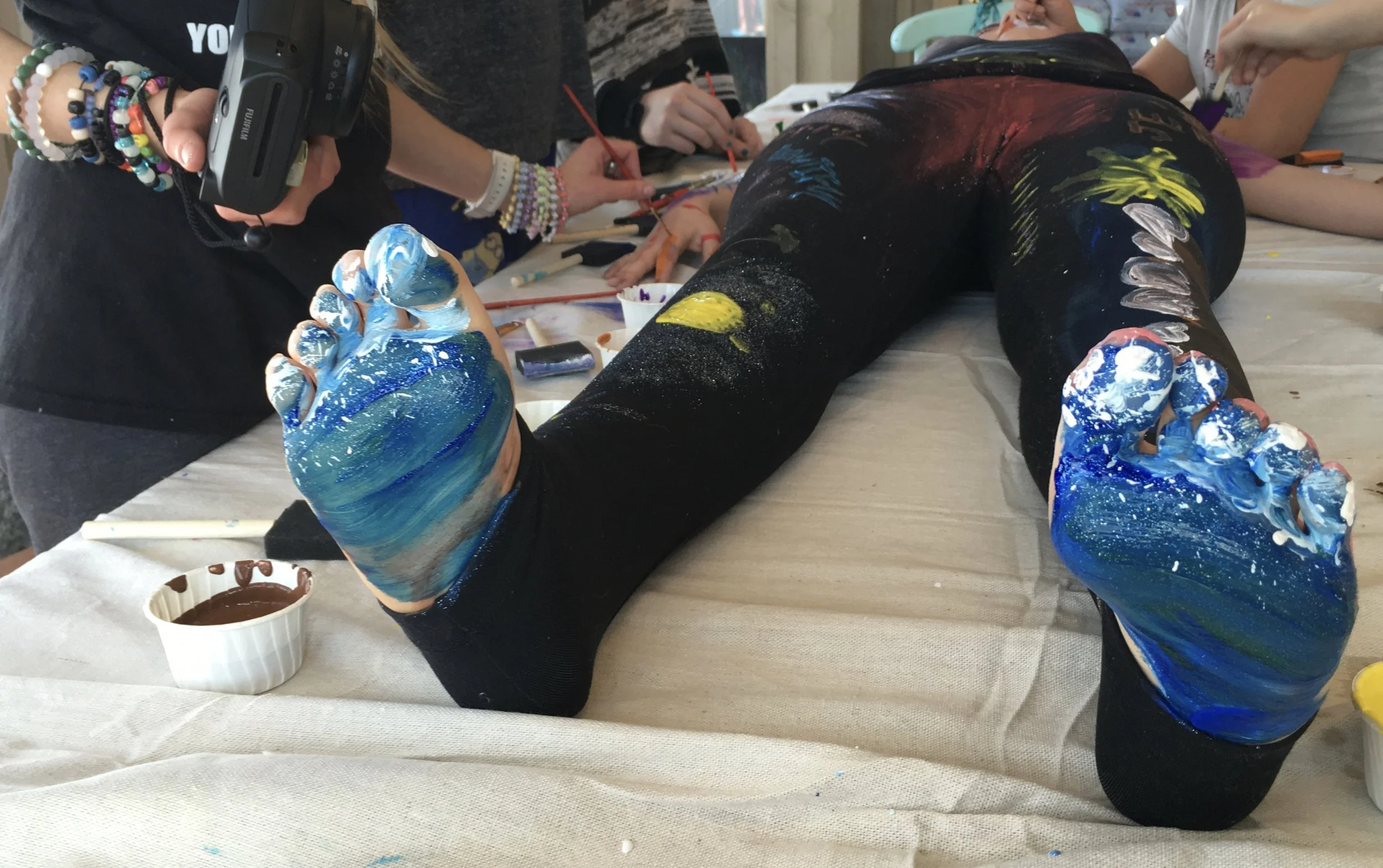 painting on someone else to explore how we touch each other and paint each other's worlds