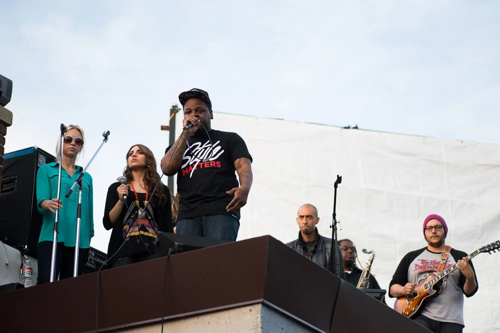 Jabee performing on top of Velvet Monkey Salon in our Style Matters tee.