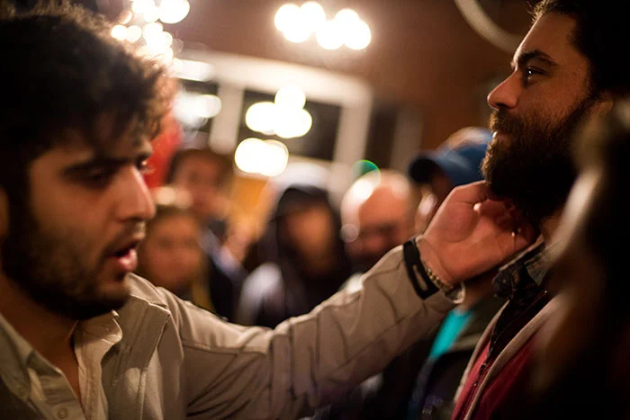 Chuck checking beards for imperfections, softness, and cleanliness.