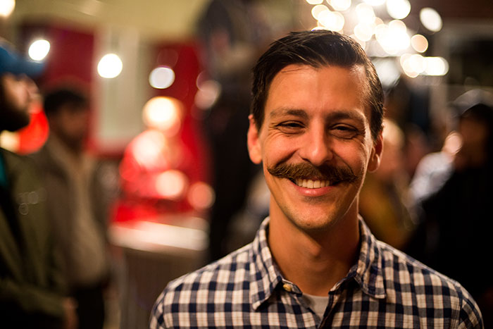 John Metcalf beaming with his 3rd year victory in the Best Mustache category.
