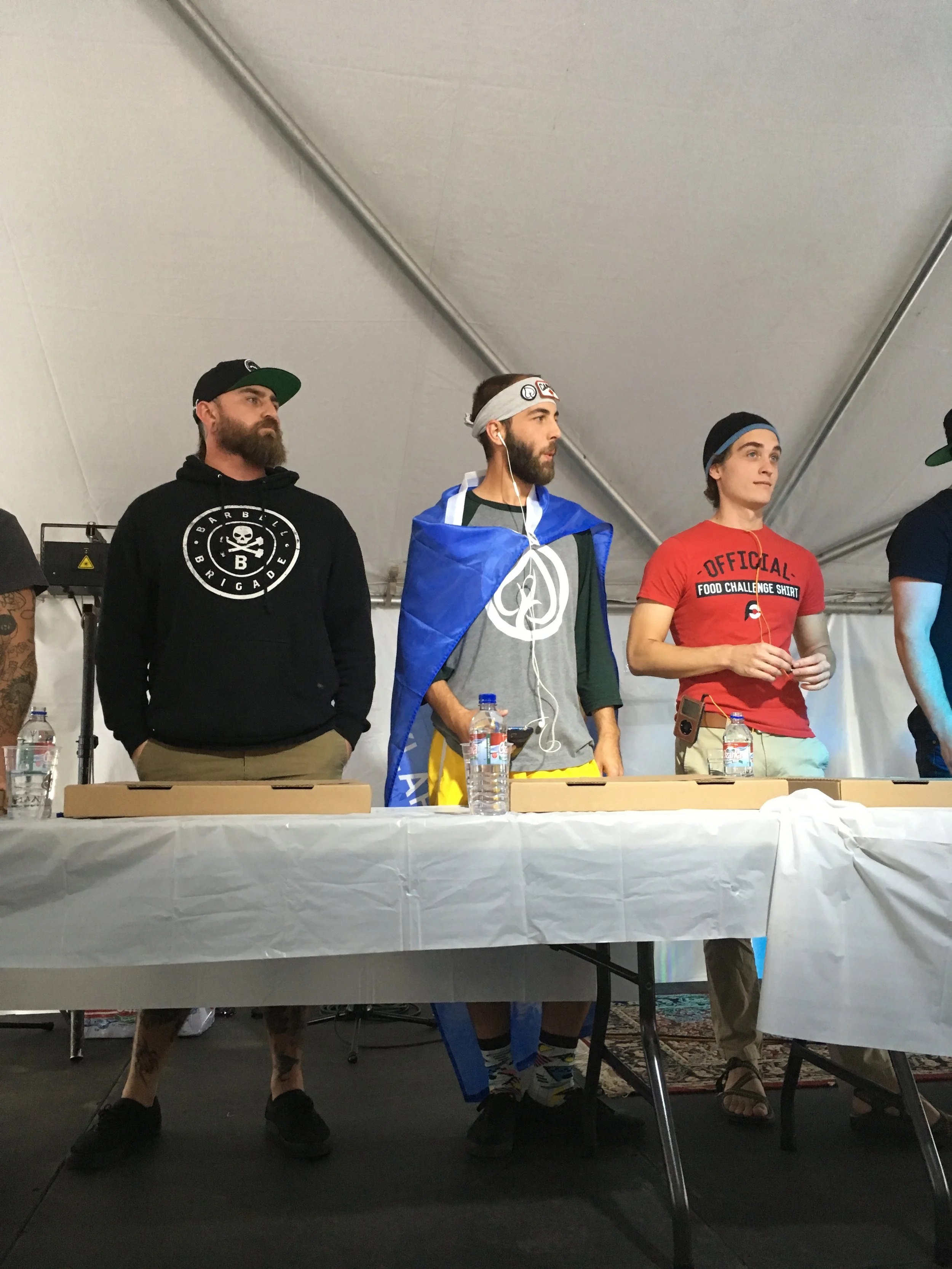 Rules and regulations. Notice the guy in the red. What does his shirt say? "Official Food Challenge Shirt." OH SNAP.