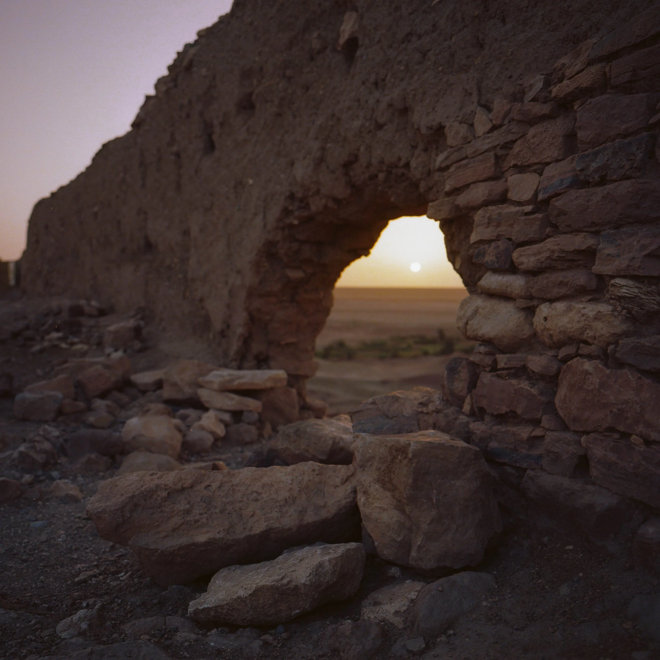 A new sun greets the ruins of an old fortress. High Atlas, Morocco. 