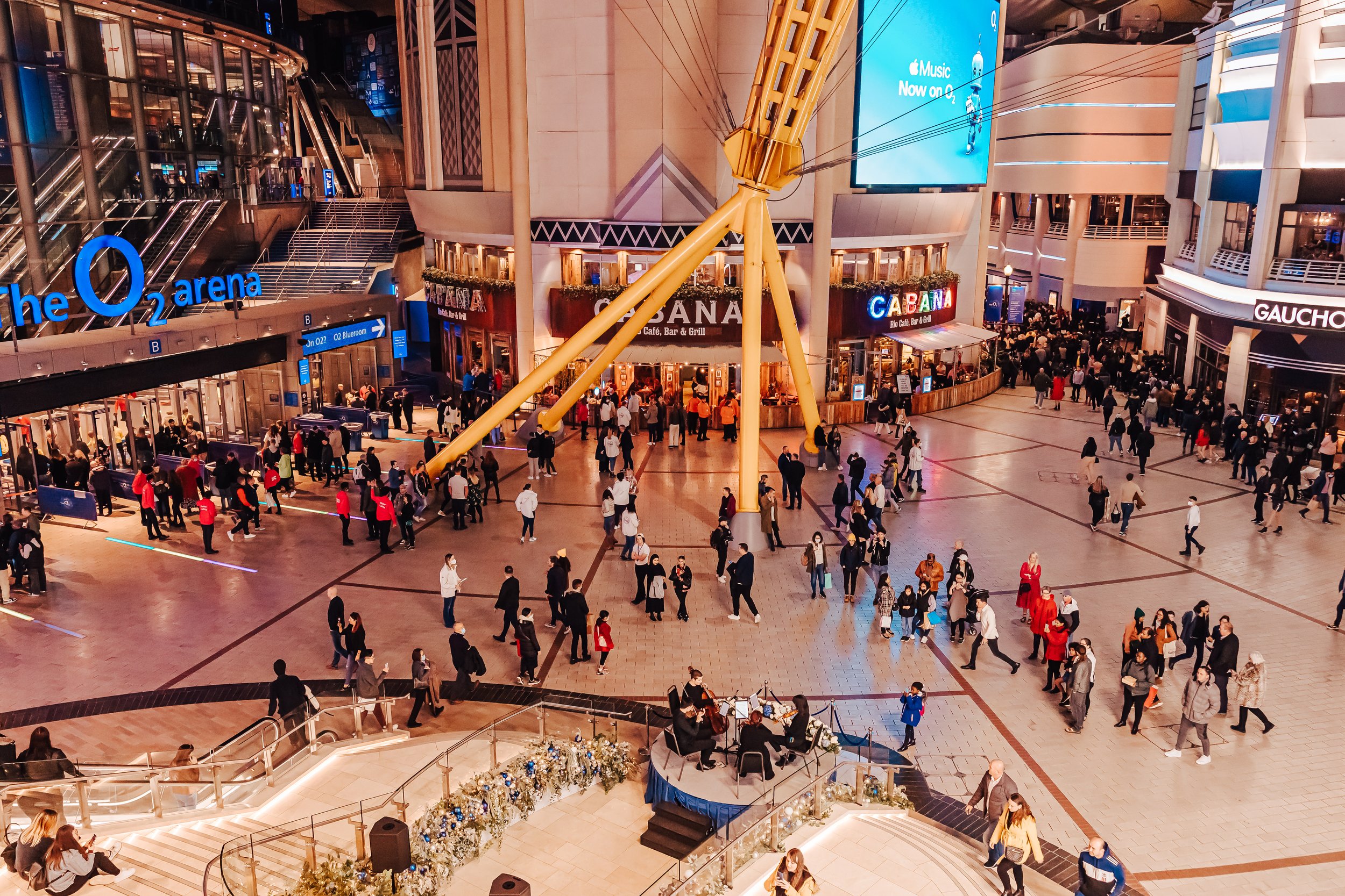 City String Ensemble providing live string quartet entertainment in the O2 Arena foyer for a large scale corporate marketing event.