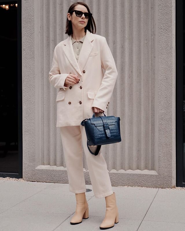 The Quarantine Fashion Series: This mint-colored shirt blends in perfectly with the creamy pastel tones of the look, accented by a bold blue crocodile print handbag. #quarantine #stayhome