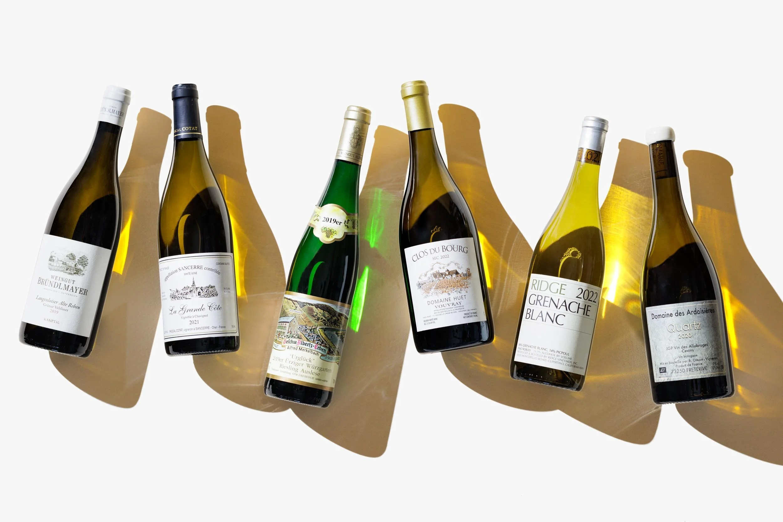 Bottles of white wine photographed by Boston wine photographer Adam DeTour for Gordons Fine Wine