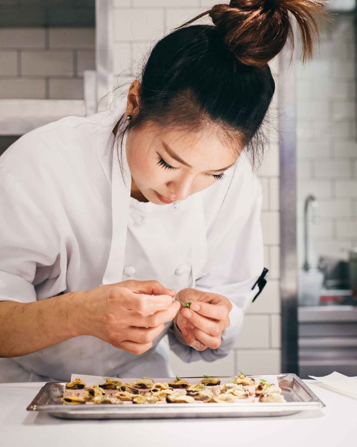 Chef working in kitchen at Menton in Boston photographed by Adam DeTour in 2014 for Boston Magazine