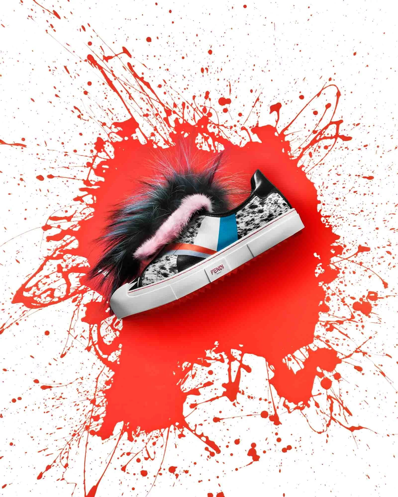Furry sneakers on a red painted backdrop featured in the improper bostonian and photographed by product photographer Adam DeTour