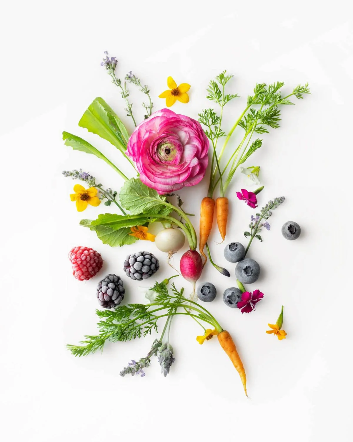 Edible flowers and tiny vegetables photographed by food photographer Adam DeTour
