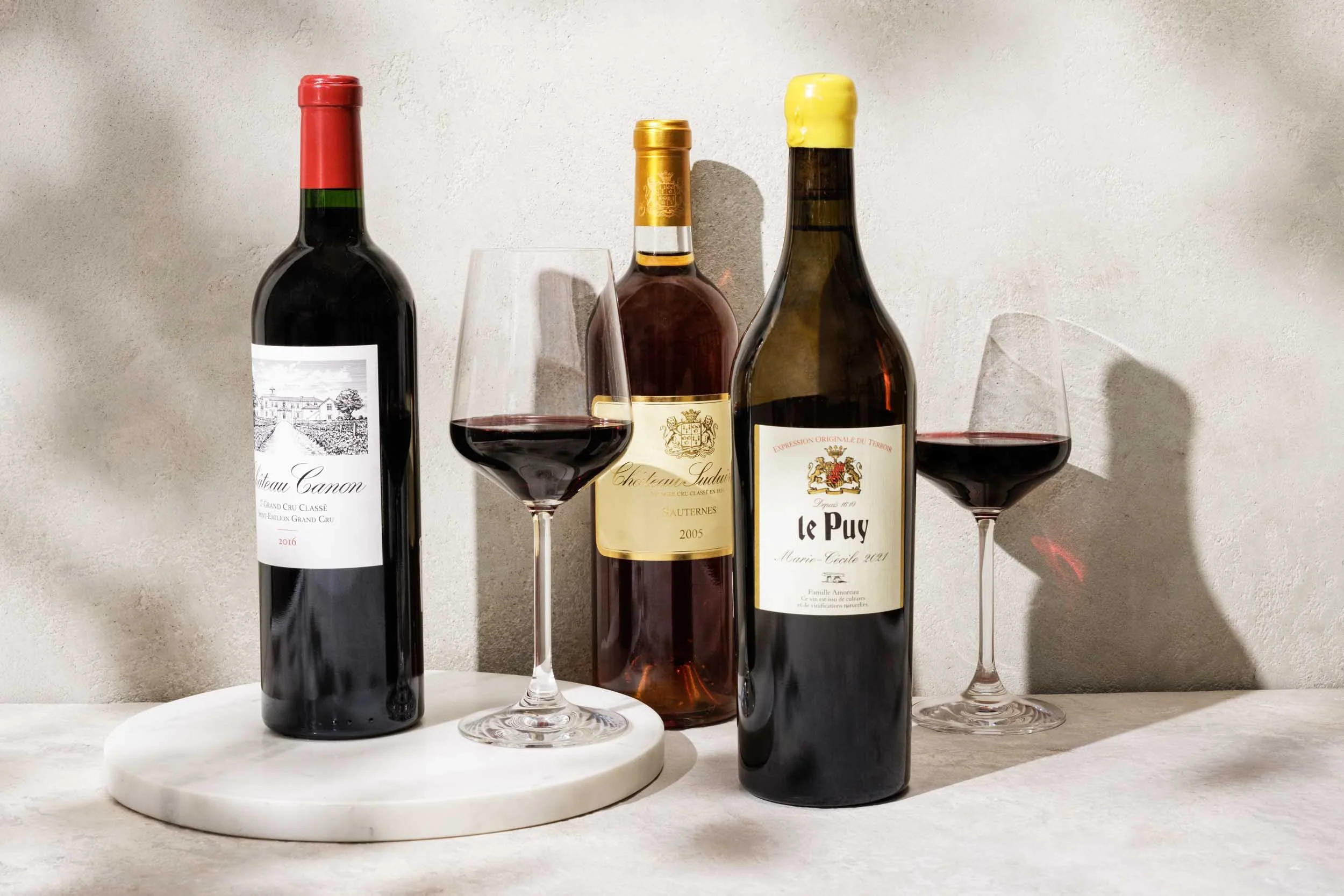 Assorted bottles of wine and glasses photographed by Boston Cookbook Photographer Adam DeTour for Gordon's Fine Wine