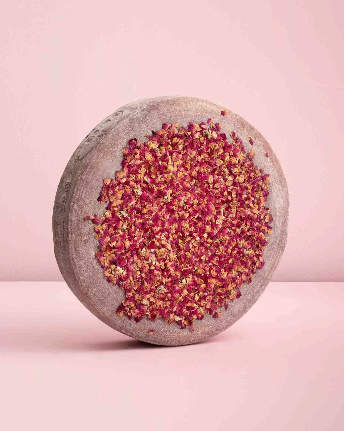 Wheel of cheese rolled in edible flowers photographed by magazine photographer Adam DeTour
