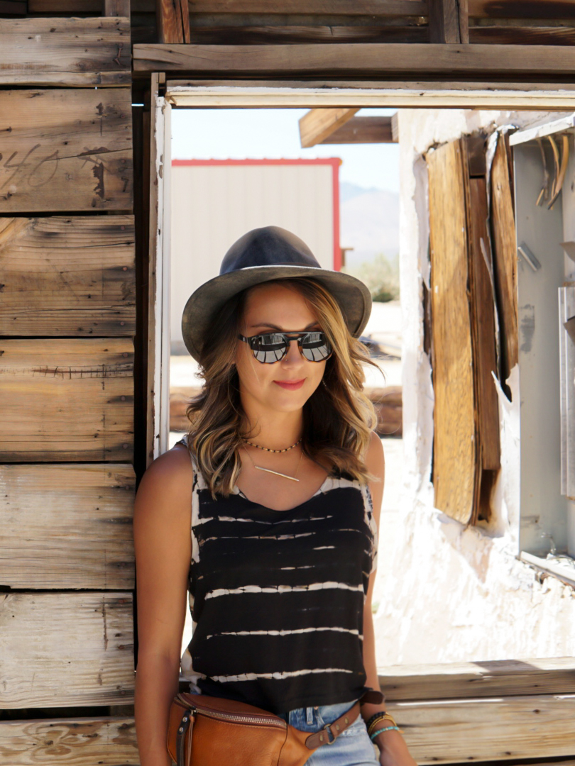 Wearing Bailey Hats, Sunski, and Will Leather Goods