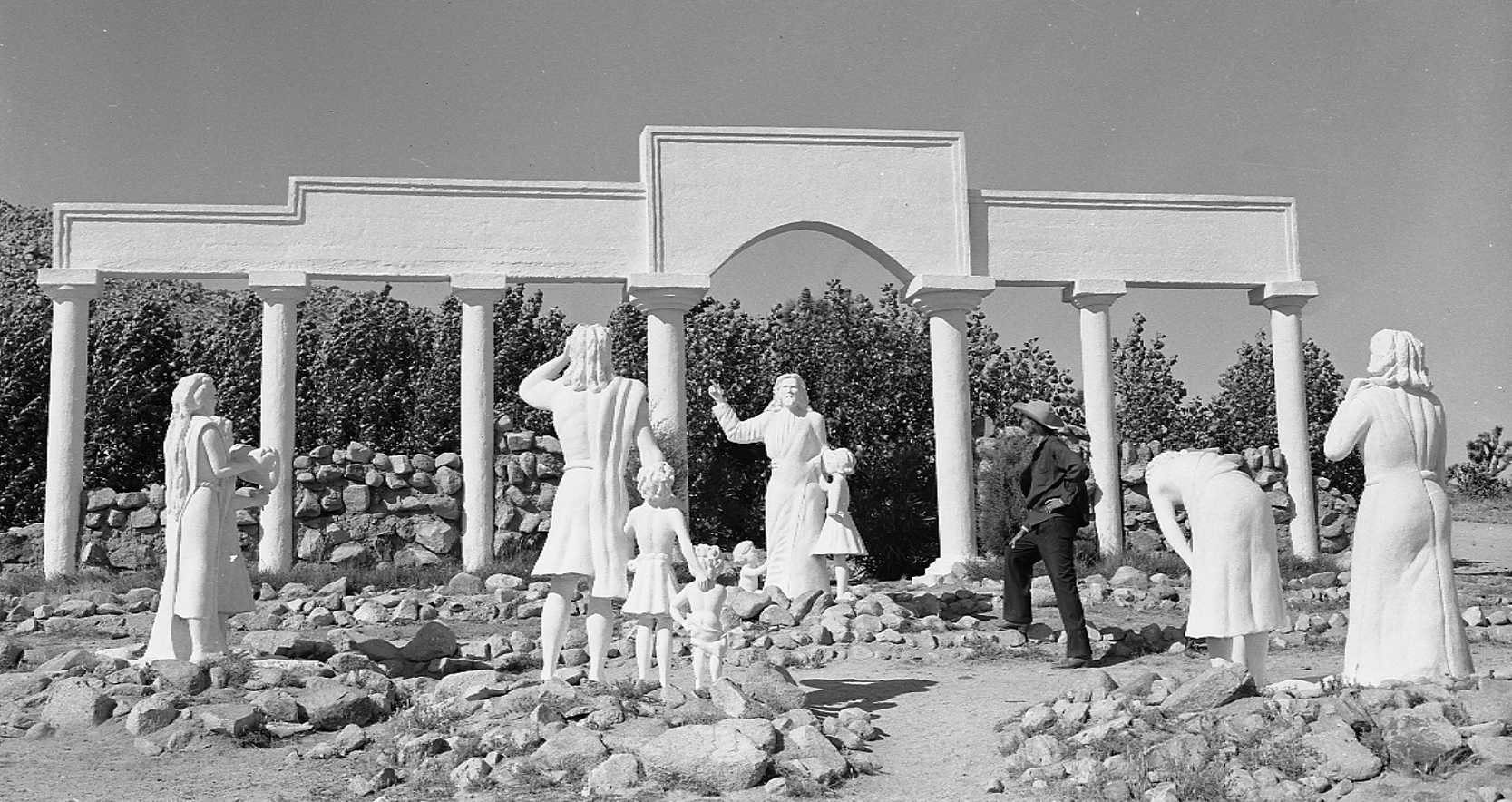 Old image of sculptor Frank Antone Martin with some of the statues