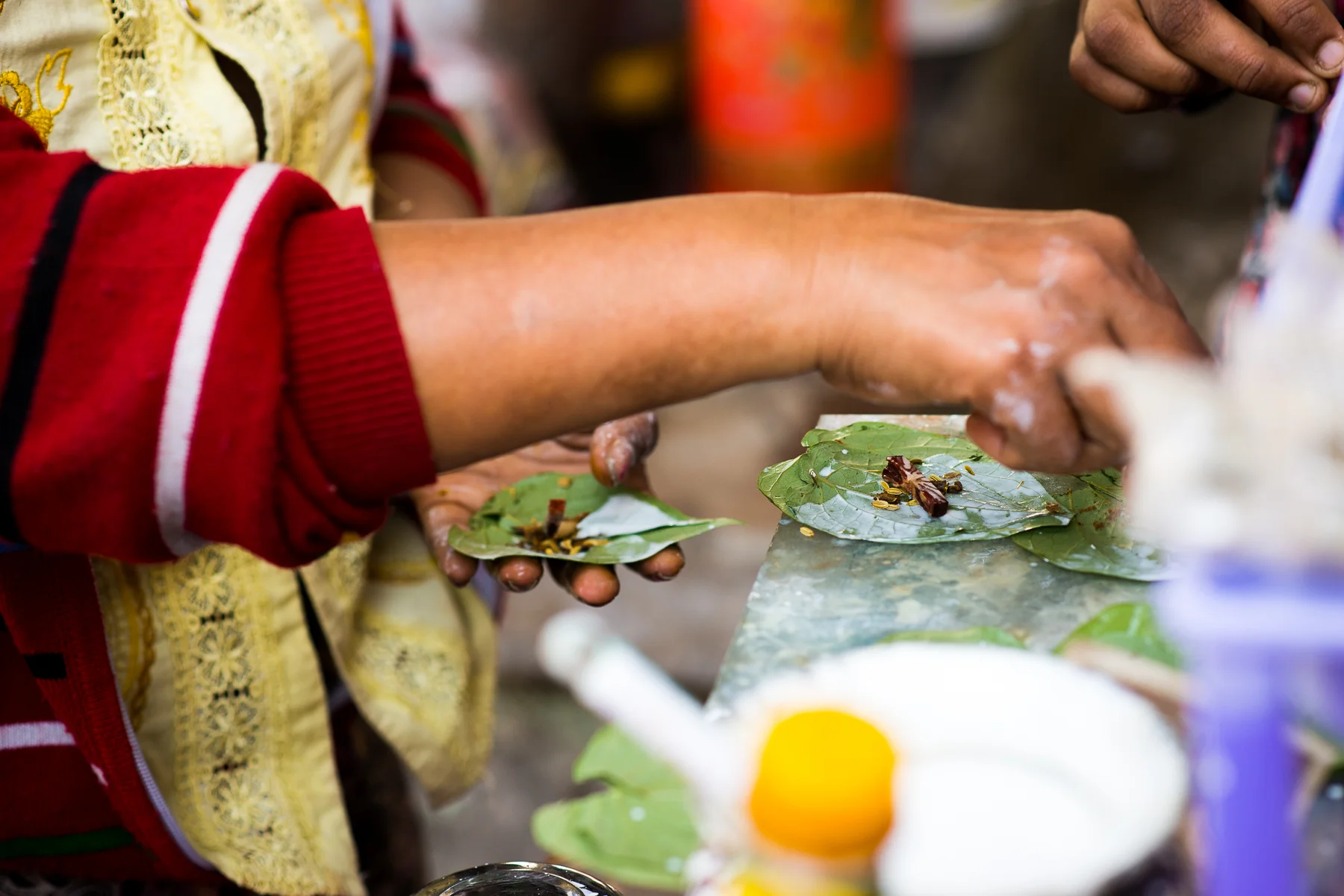 Bitter root wrapped in a leaf.  The taxi drivers and a lot of people chew on these all day.  I guess to stay awake.  I'm told it's also very addicting.  Yangon, Myanmar