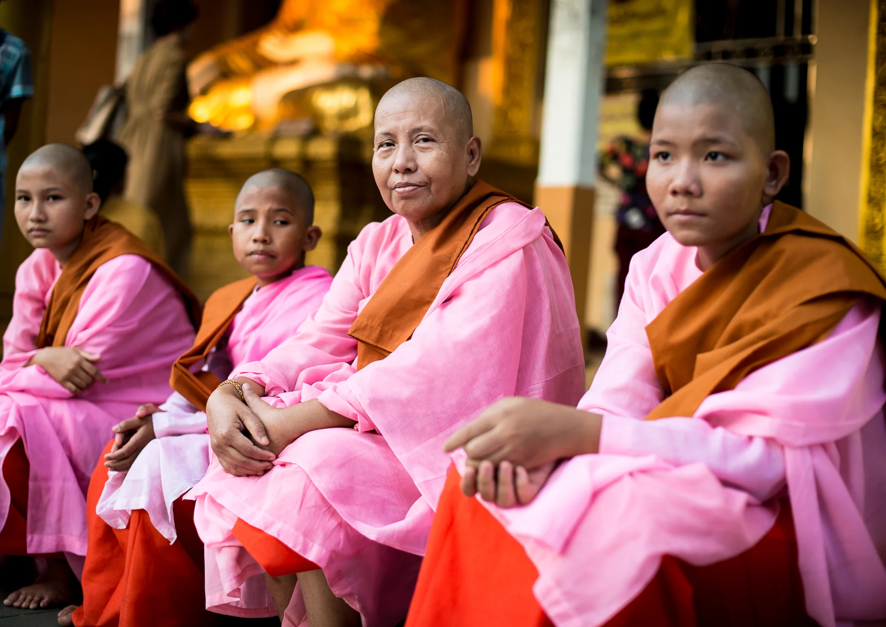 Buddhist nun with novices at Shwedagon Pagoda.  Yangon, Myanmar