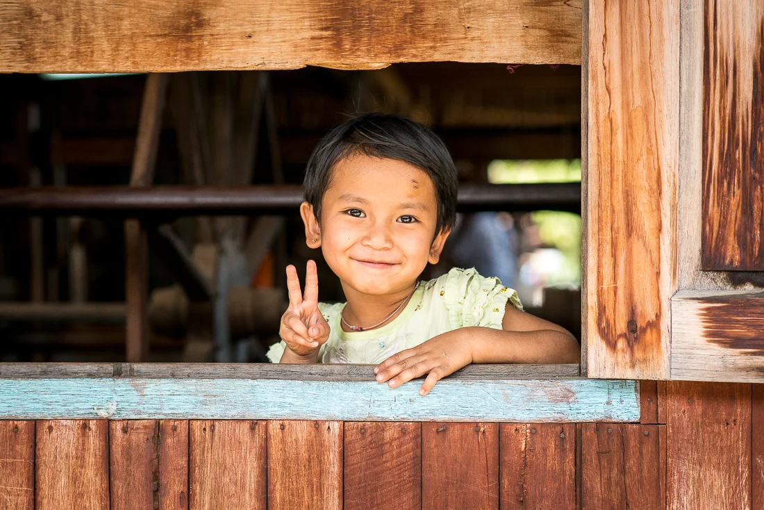 Village girl at weaving factory. Inle Lake, Myanmar