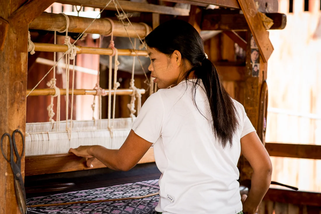 Woman operating a loom. Inle Lake, Myanmar
