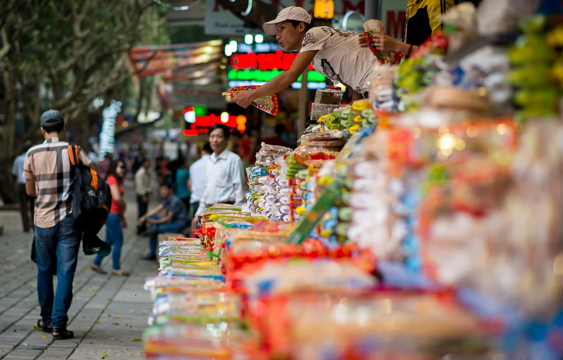 Vendor selling different sweet items in the Perfume Pagoda. Hanoi, Vietnam
