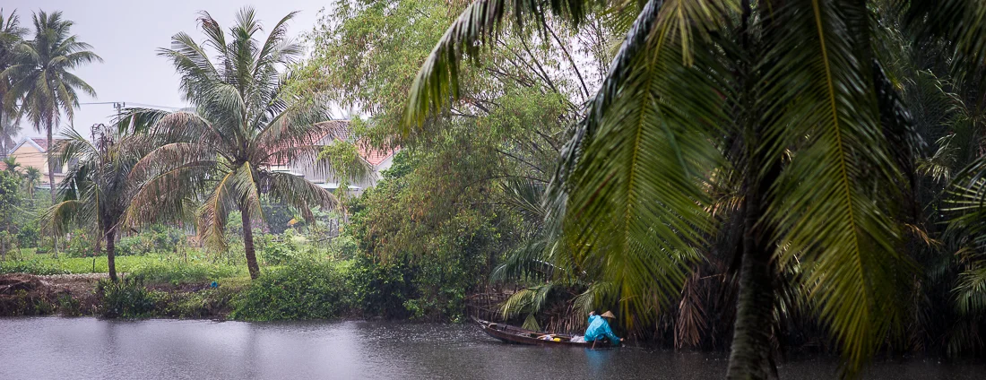Fishing on the river in the rain. Hoi An, Vietnam