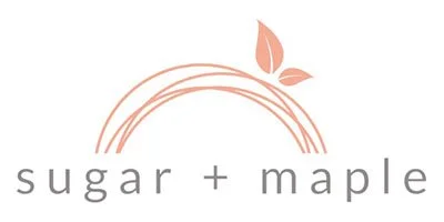 Logo with a stylized sugar maple leaf and arches above the words "sugar + maple" in gray text.