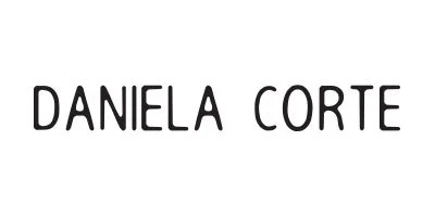 The name "DANIELA CORTE" written in black capital letters on a white background.