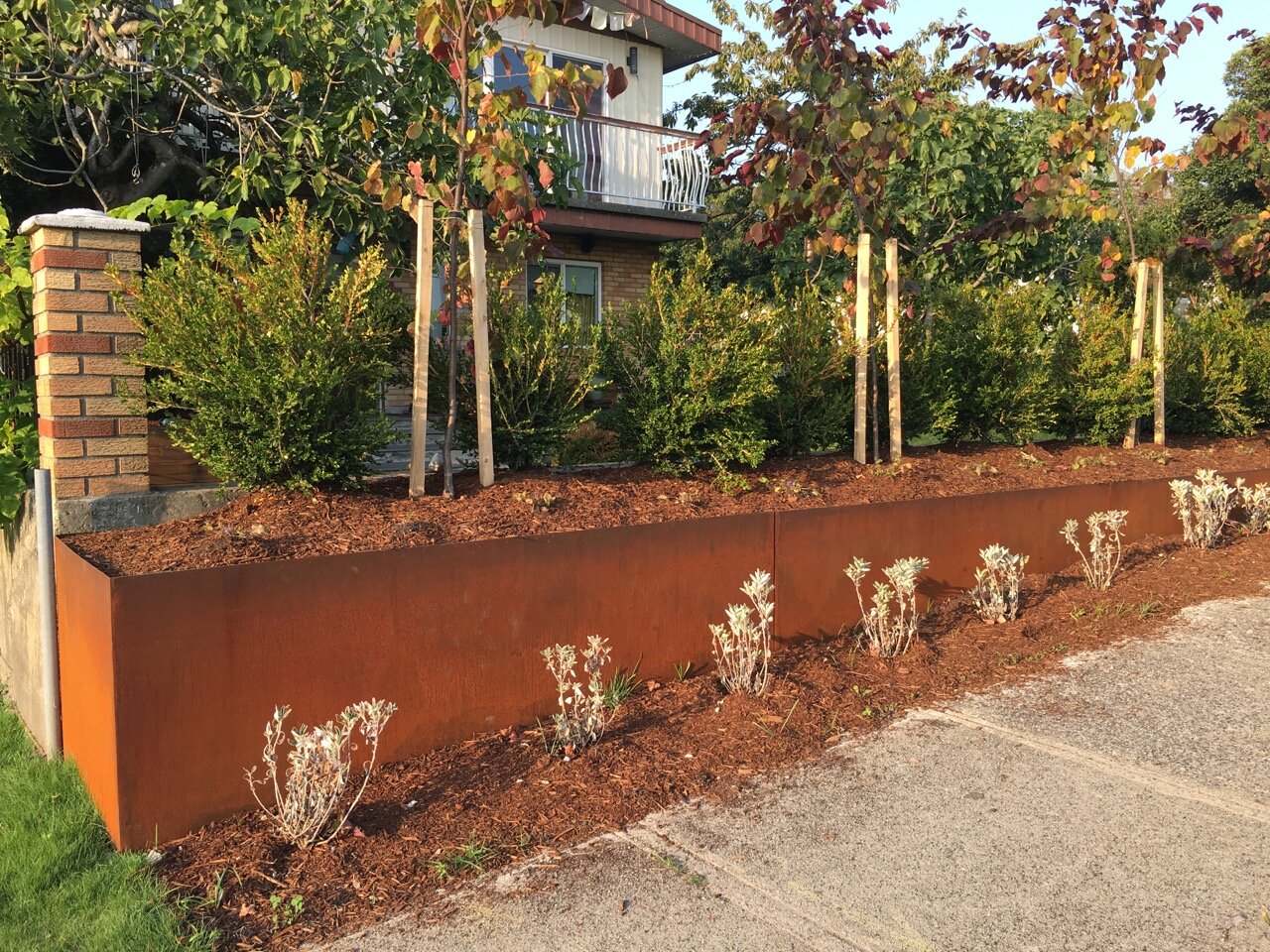 Rusty planter retaining wall