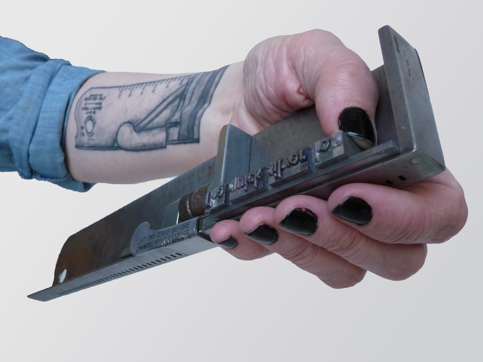How you hold a composing stick. Photo by Elise Levi.
