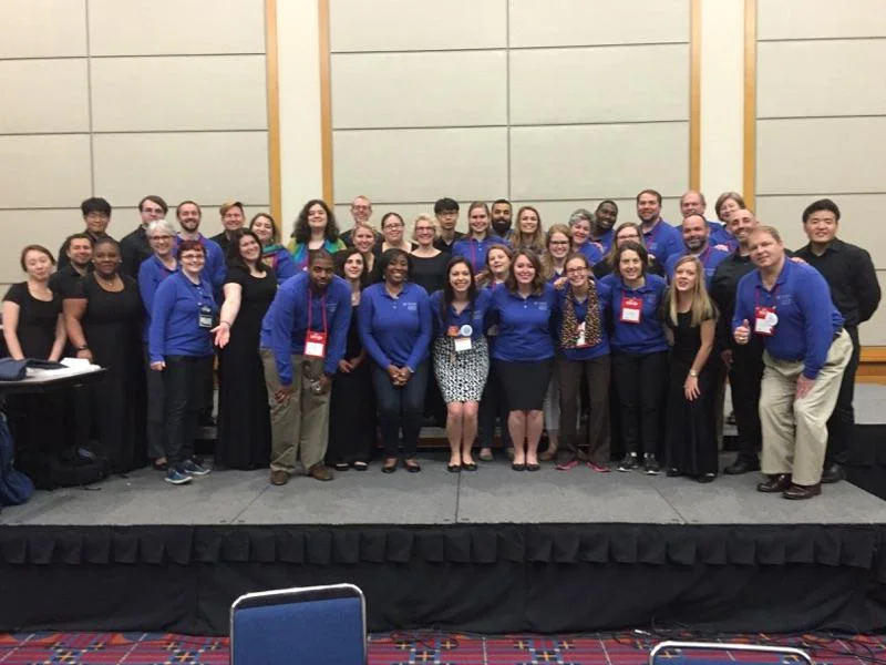 Glenn member and Associate Dean of Methodist Studies at Candler, Rev. Dr. Anne Burkholder, took a class to General Conference (Burkholder and students pictured in blue). They stand among the Candler Singers who gave their last performance under the direction of Dean of Worship, Rev. Barbara Day Miller, who is retiring after many years of faithful service to the school.
Normal
0
false
false
false
EN-US
X-NONE
X-NONE
/* Style Definitions */
table.MsoNormalTable
{mso-style-name:"Table Normal";
mso-tstyle-rowband-size:0;
mso-tstyle-colband-size:0;
mso-style-noshow:yes;
mso-style-priority:99;
mso-style-parent:"";
mso-padding-alt:0in 5.4pt 0in 5.4pt;
mso-para-margin:0in;
mso-para-margin-bottom:.0001pt;
mso-pagination:widow-orphan;
font-size:10.0pt;
font-family:"Times New Roman",serif;}
Glenn members pictured include Yeeun Bae, Sara Maughan, J.R. Atkins, Brenna Lakeson, Sara McKlin, and intern Tiffania Willetts. Photo credit: Nefertiti Williams