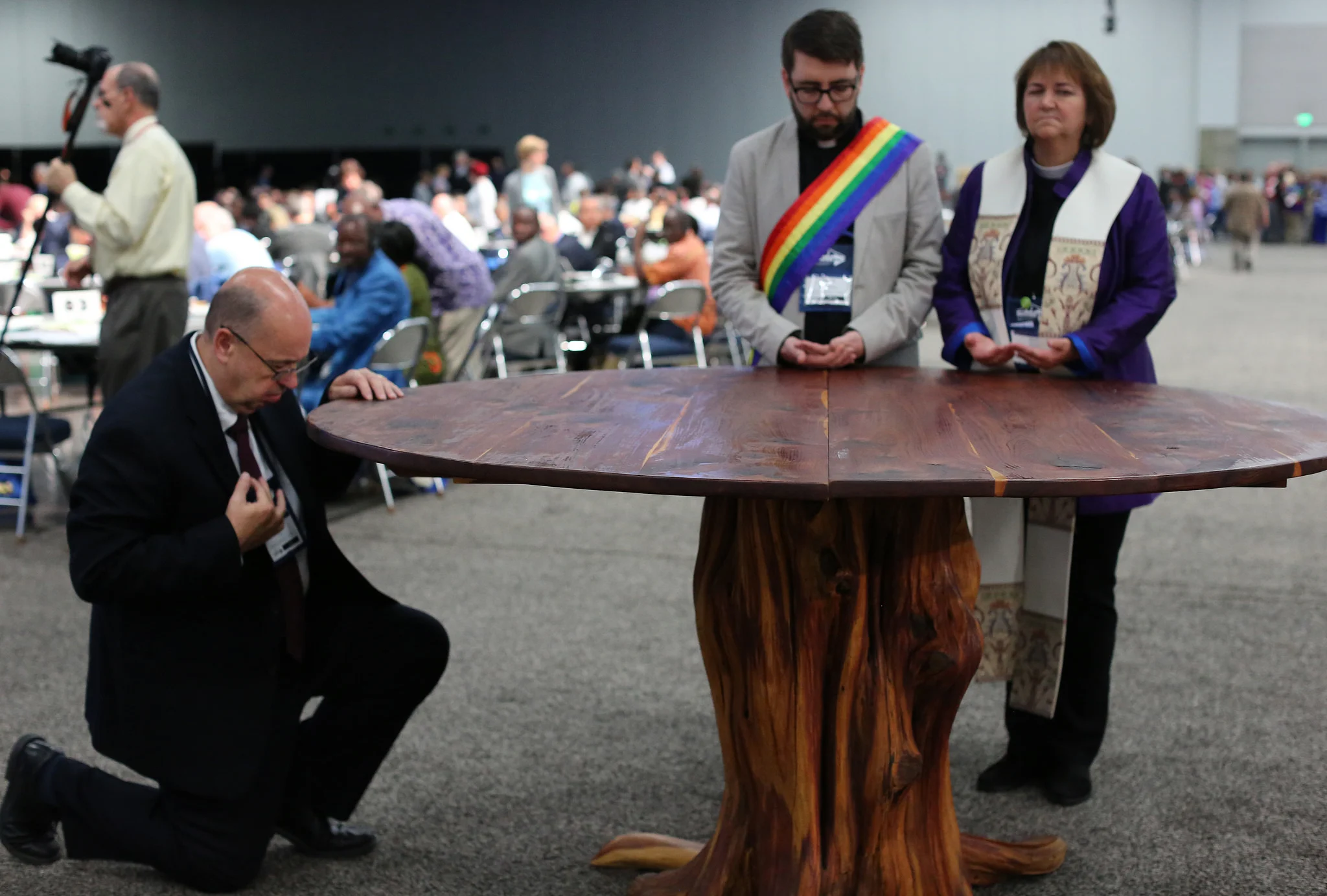 Prayer at the center altar. Photo credit: Kathleen Barry, UMNS