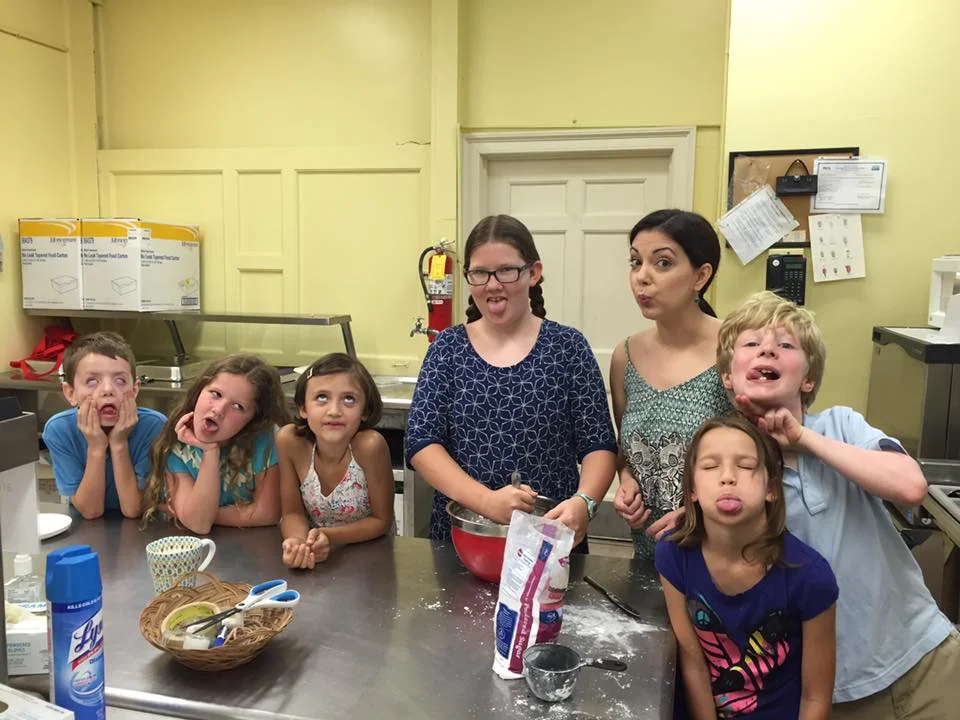 Tiffania (third from right) trying to teach Sunday Schoolers a thing or two about cooking.