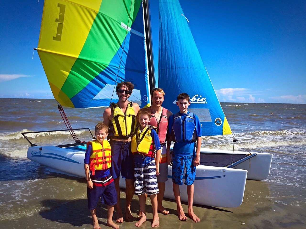 Brent pictured with his three sons and brother.