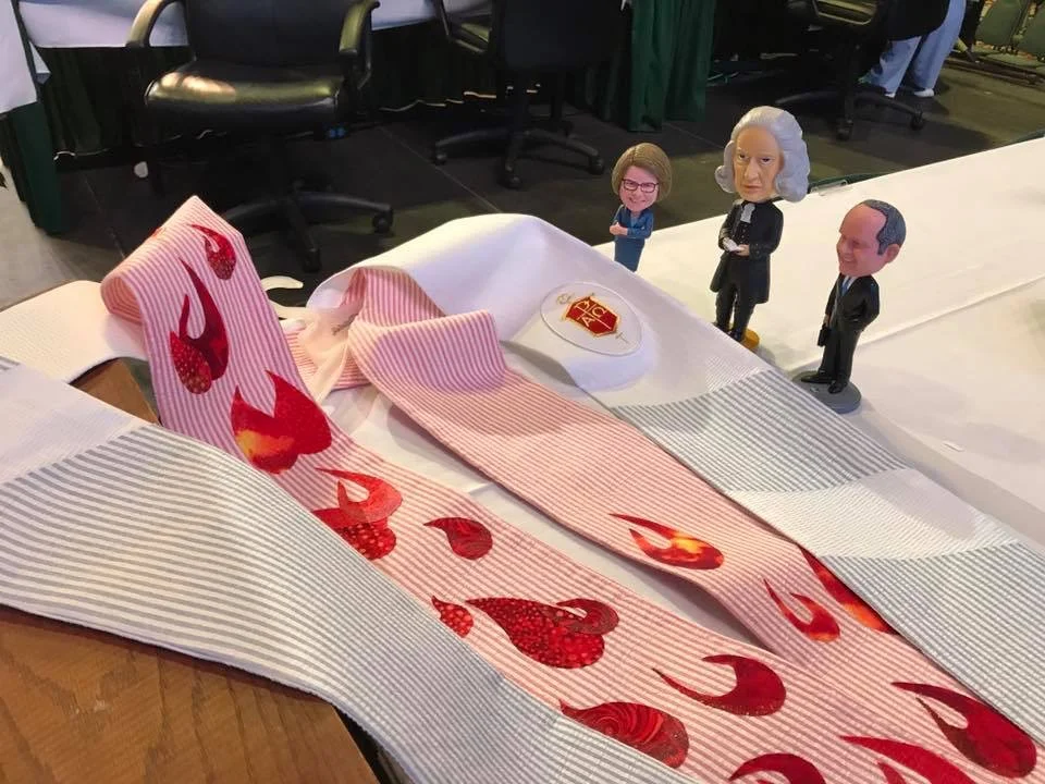 Bishop Sue's new stoles, and the infamous bobbleheads.