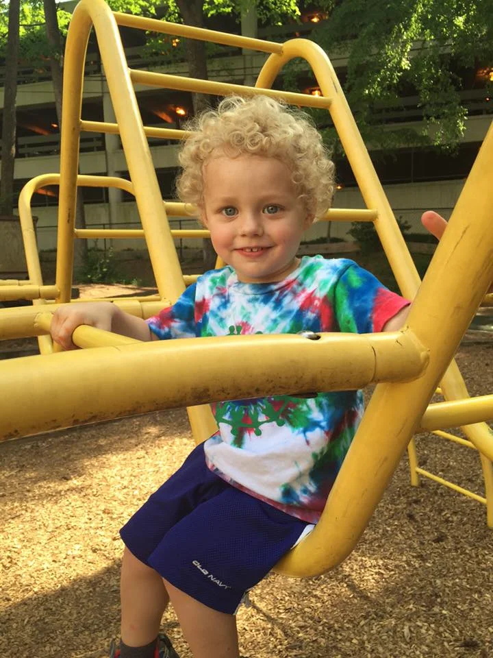 Bethany's son, Adam, feeling brave on the big yellow bug.