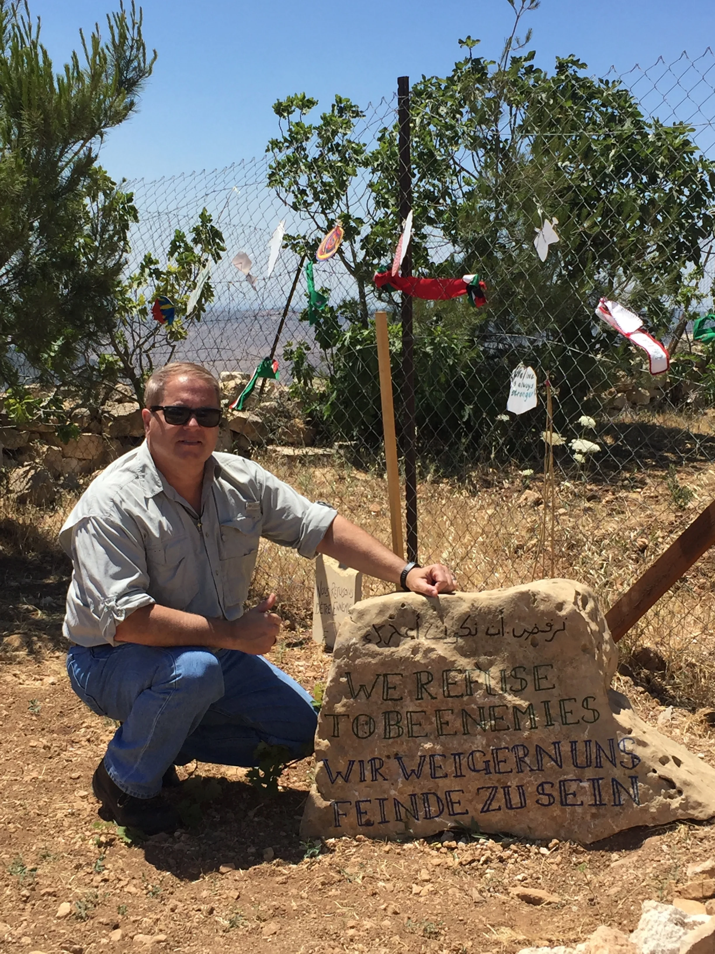 At the entrance to the Tent of Nation. The stone says, "We refuse to be enemies’" in Hebrew, English, and Arabic.