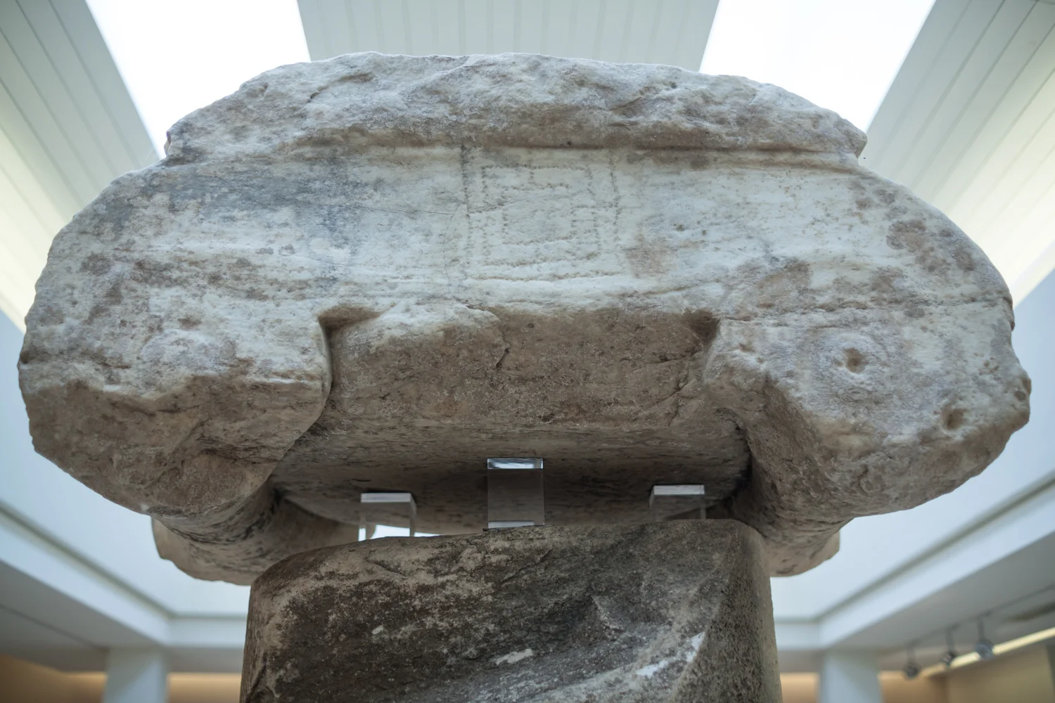 Marathon "trophy" column. On the top of the capital can be seen the carving of a game board, most likely after the column was toppled and reused during the middle ages.