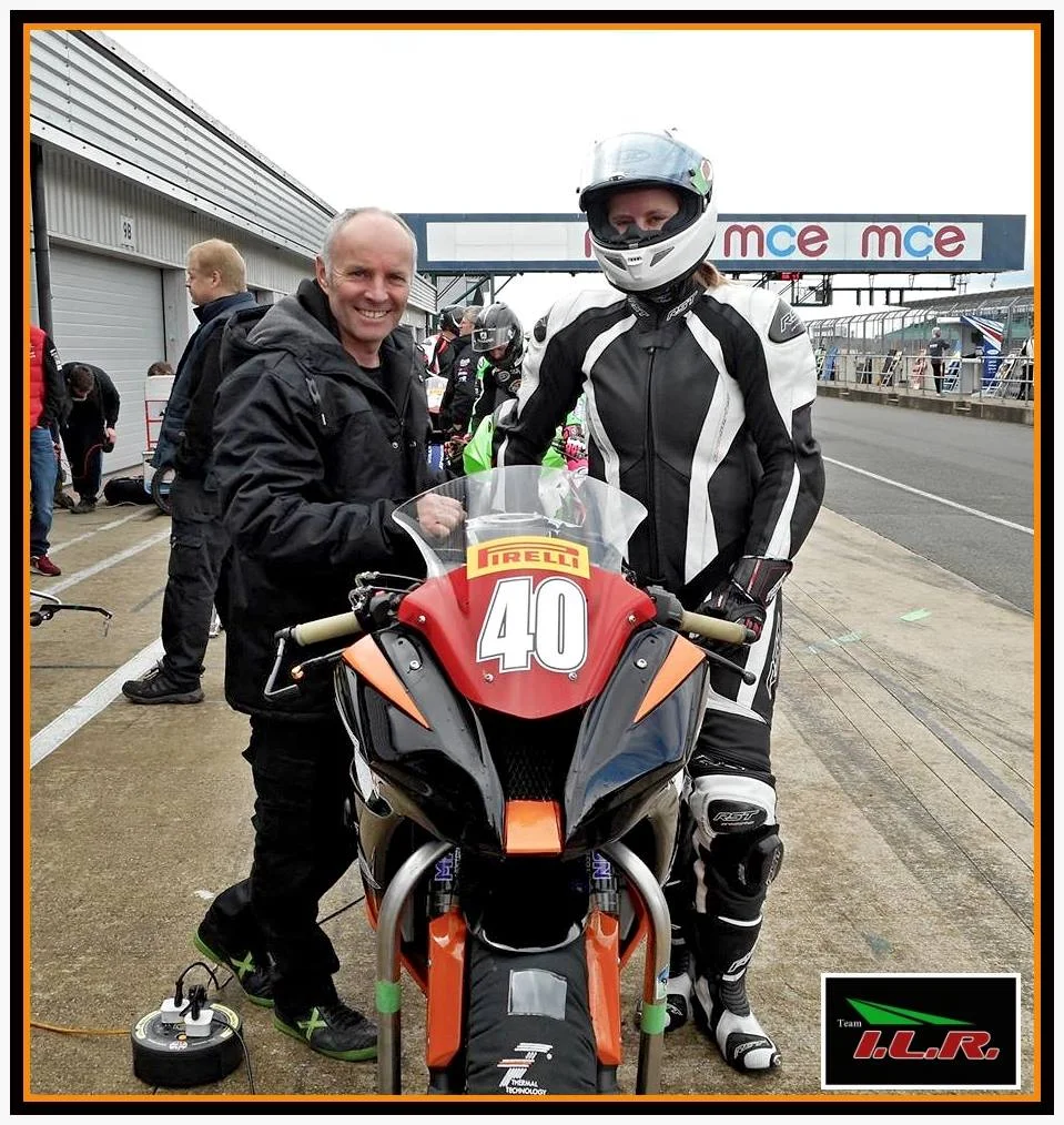Waiting for conditions to improve with team owner Ian Lougher, in pitlane during FP.