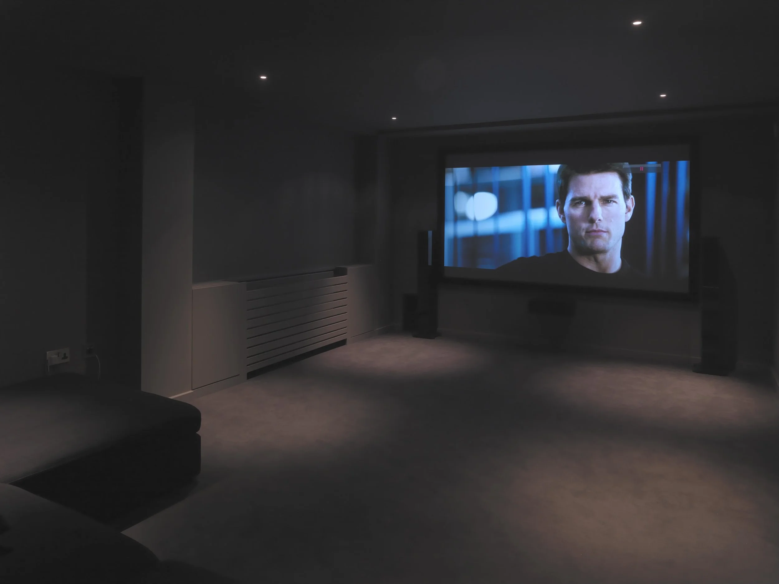 Media room in sub-basement in darker tones