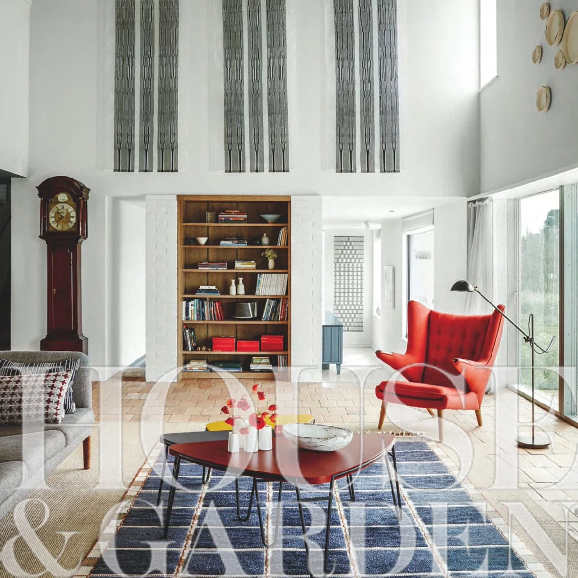 Sitting room with vaulted ceiling, pamments on floor, and sliding doors to the gardens