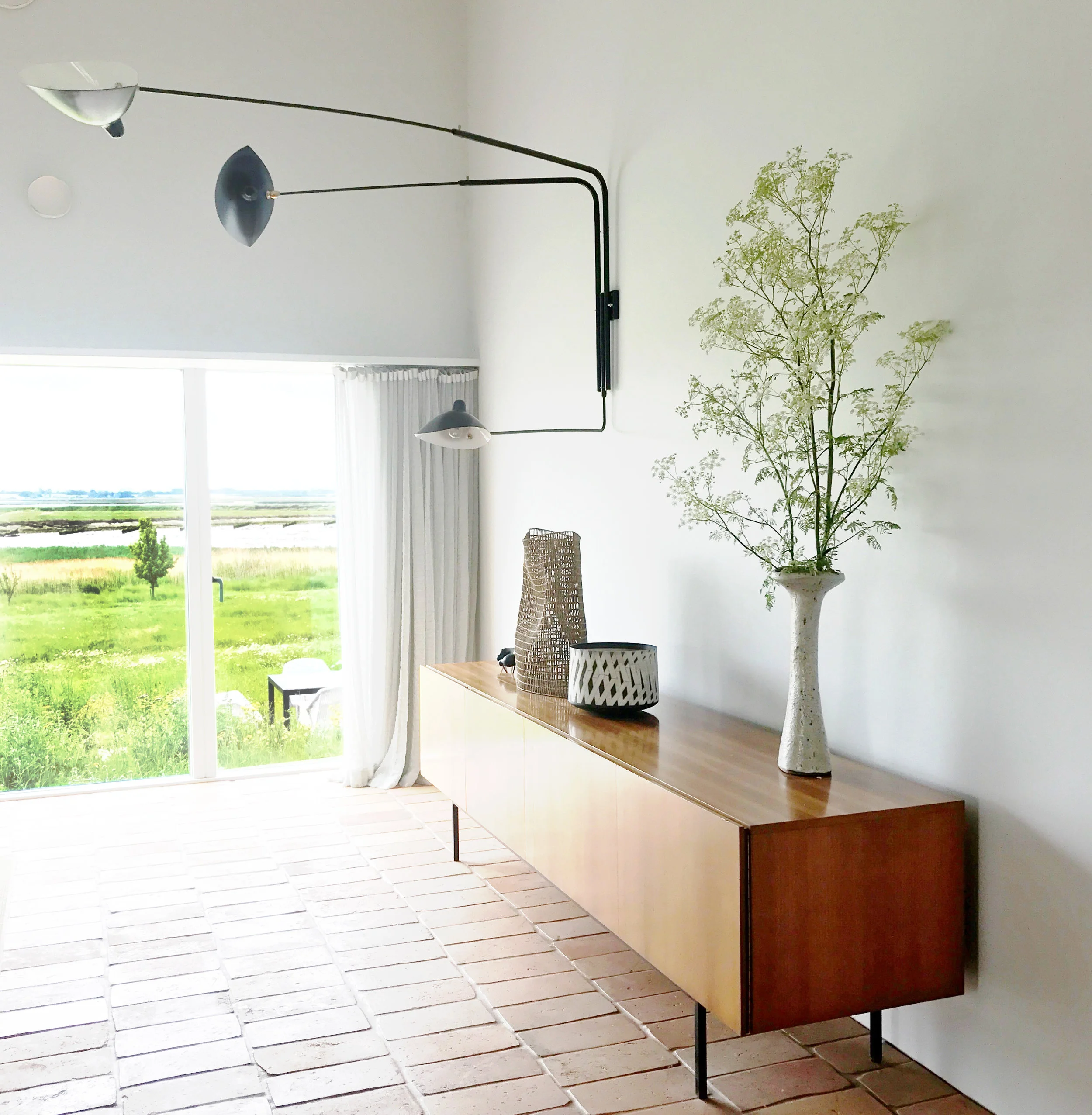 Sitting room detail, Serge Mouille light, 1960’s cabinet, Lucie Rie vase