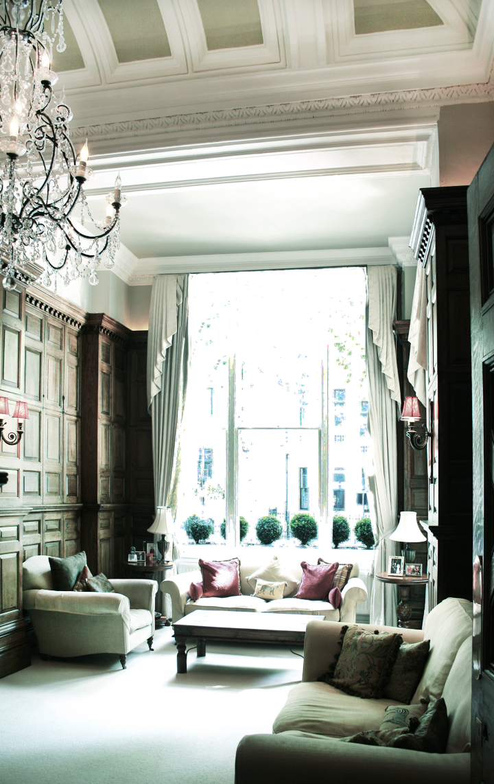 Main drawing room, restoration of existing wooden panelling, installing of new lighting above panelling to light detailing on ceiling, picked out by specialist painters, bespoke brass and glass chandelier, based on French original