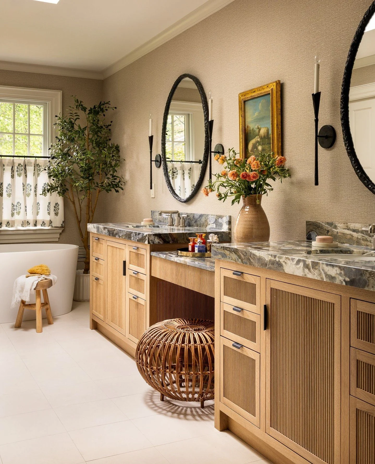 A study in material harmony and quiet sophistication.⁠
In collaboration with @boucherinteriors, this bath sanctuary pairs ribbed oak cabinetry with a richly veined stone countertop, creating depth through contrast and texture. Soft daylight, curated 